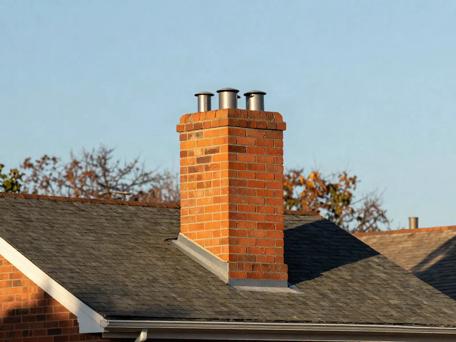 Brick chimney on a home served by Terra Cotta Chimney Sweeps in Southington, CT